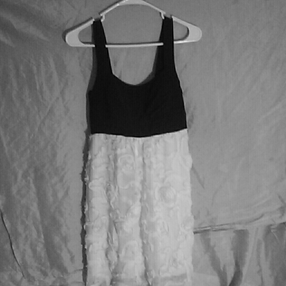 A half black top and bottom rose white dress